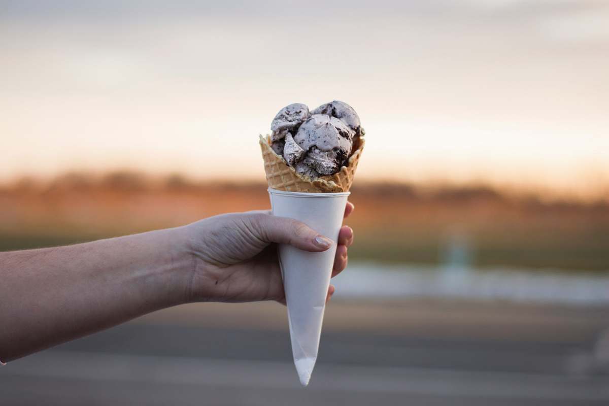 ice cream person holding ice cream cream
